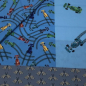 Preview: viskosestoff für schultueten in blau mit bunten formel 1 rennwagen glatt liegend
